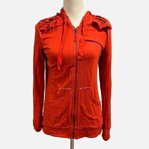 Zip up hoodie with ruffle detailing to shoulder.